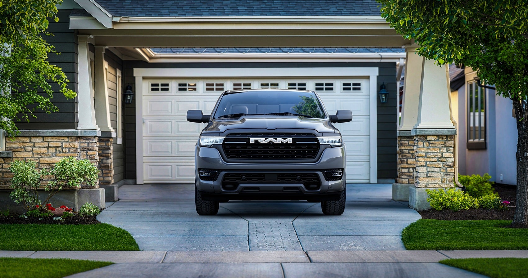 Ram 1500 Vehicle parked outside a residential garage with the front end visible